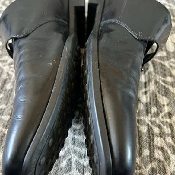 Tod’s black buckle loafers